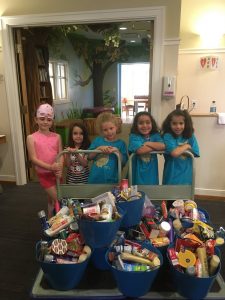 A Daisy Troop drops off cookies, cards and wish list items.