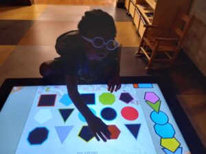 LJ playing with interactive table.