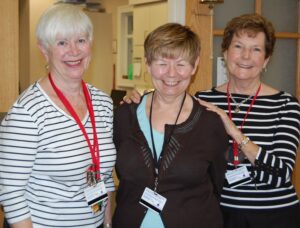 Alice Sherman, Lee Ensign, Barb Fisher smiling at camera