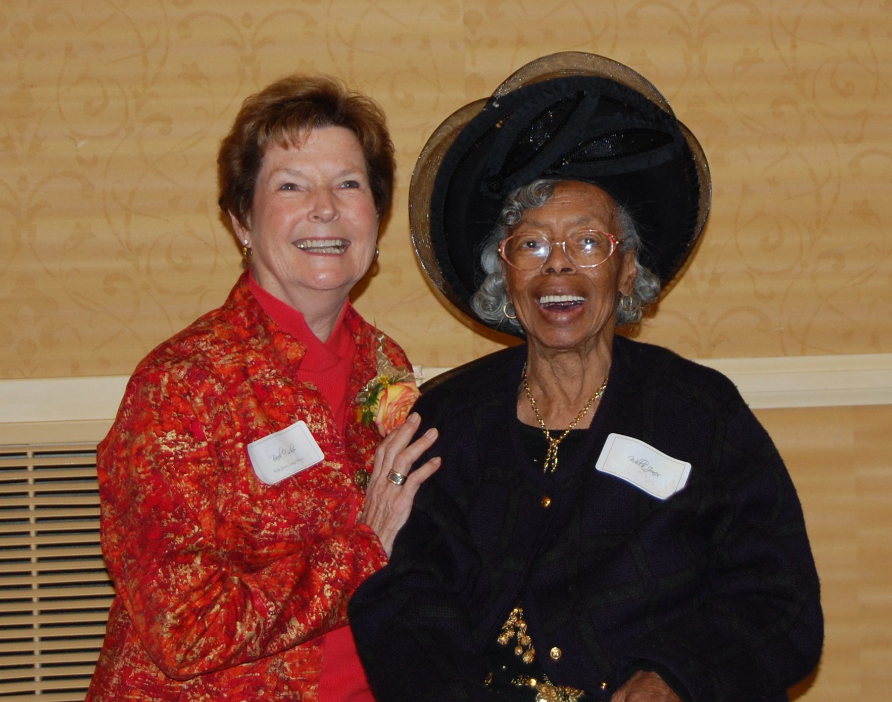 Barb Fisher and Willa Jones smiling at event.