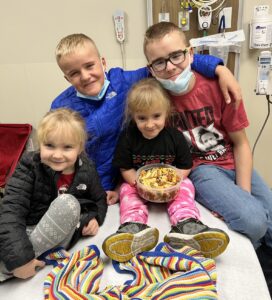 Four children on hospital bed