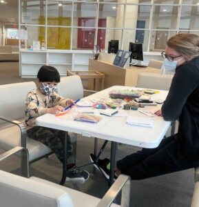 Little boy coloring at STAR Center