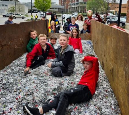 children in pull tab recycling container