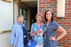 Lee, Barb, and Becka smiling at ice cream social