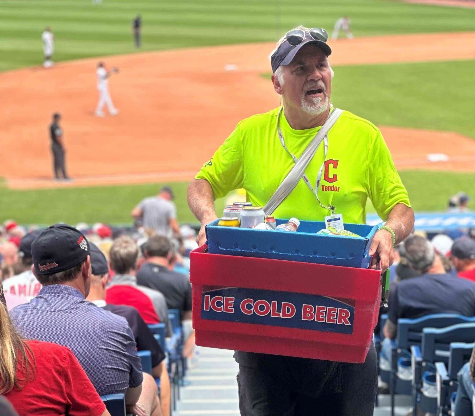 Joe carrying his vending box up the stadium stairs