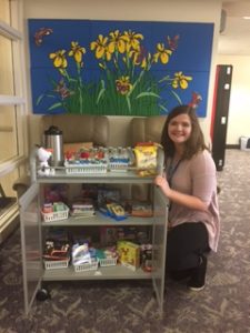 Snack cart and volunteer at the Family Room