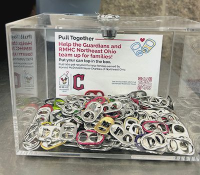 A clear plastic box with pull tabs in it, on a concession stand at Progressive Field.